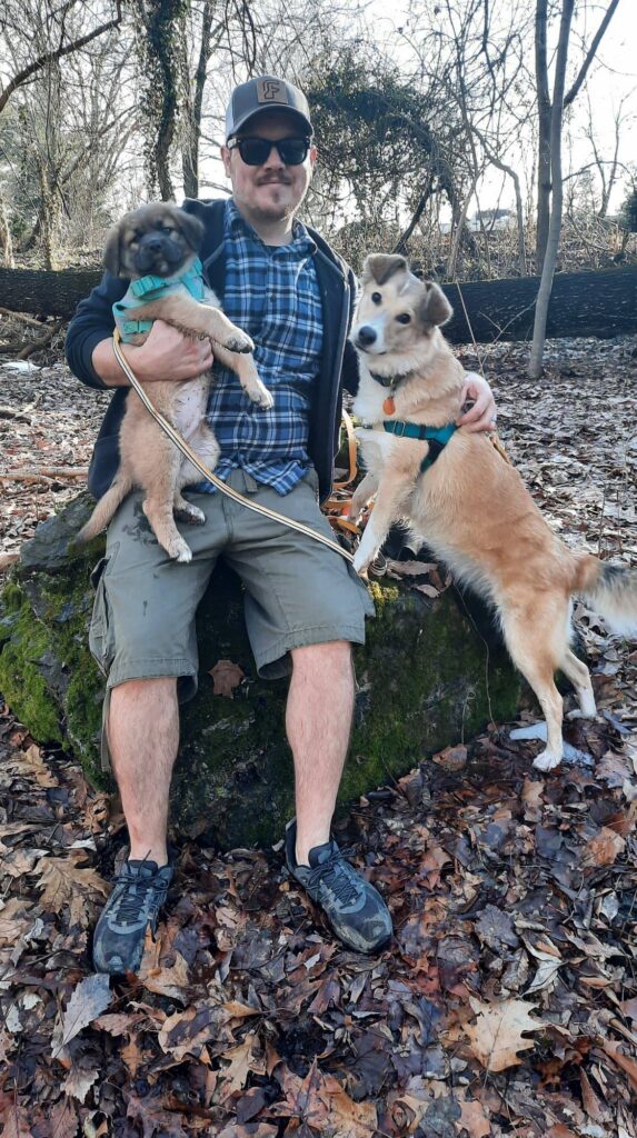 Alisha Fritz’s husband Stephen holding two dogs – family behind Full Life Behavior